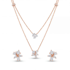 Stylish 18KT rose gold pendant set featuring a layered chain design with floral diamond pendants and coordinated earrings on a white background.
