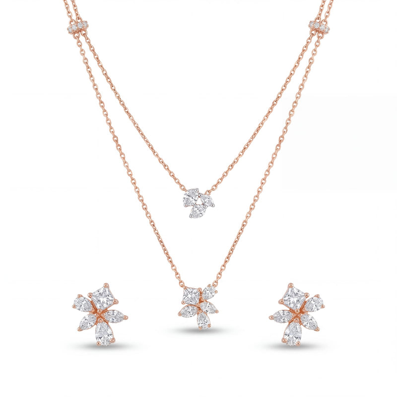 Stylish 18KT rose gold pendant set featuring a layered chain design with floral diamond pendants and coordinated earrings on a white background.