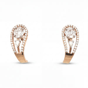 Elegant 18KT rose gold stud earrings featuring oval center diamonds with halo frames and pear-shaped accents on a white background.