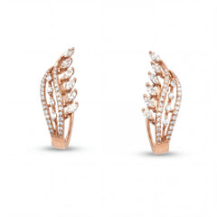 Elegant 18KT rose gold hoop earrings featuring leaf-inspired diamond motifs with pavé diamond curves on a white background.
