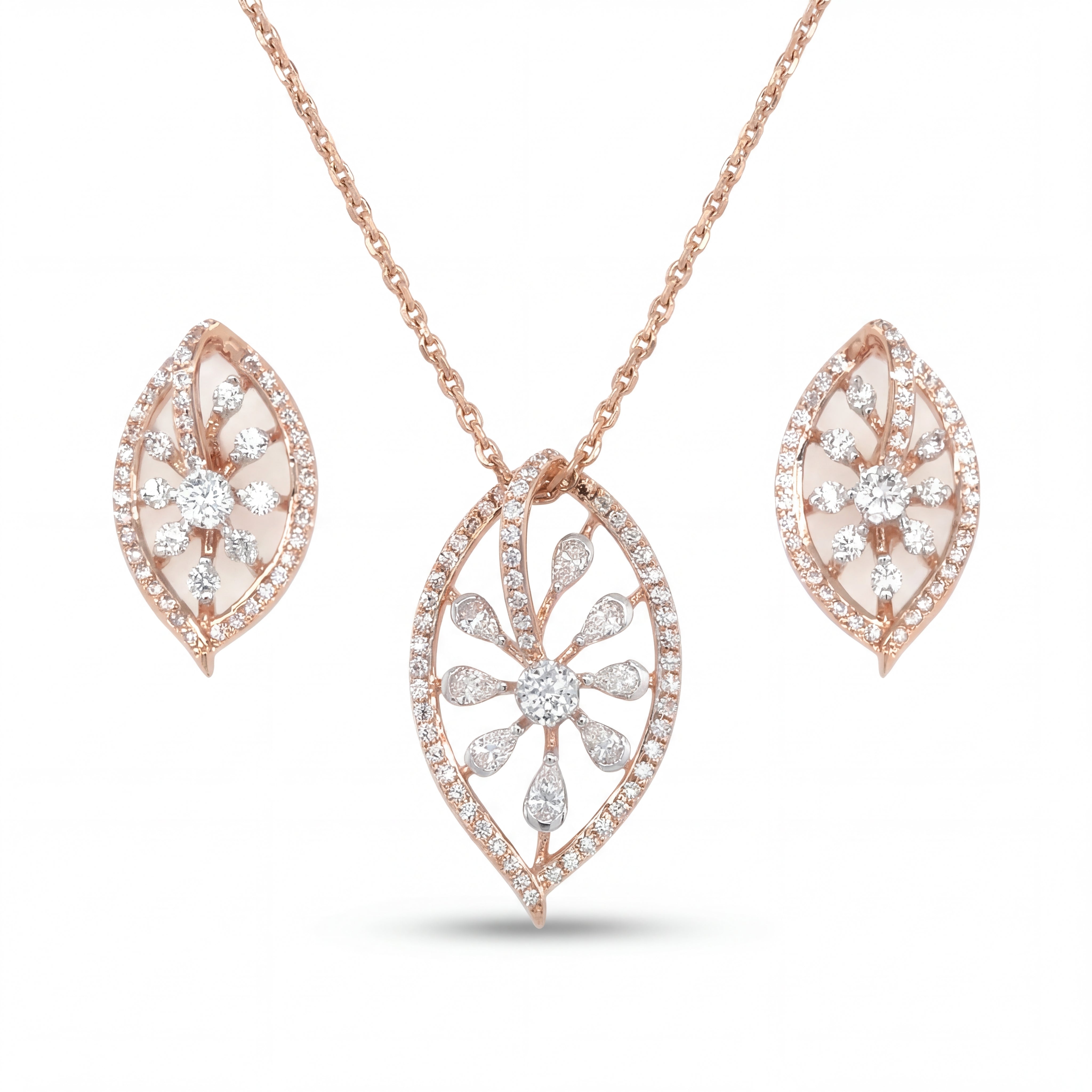 Elegant 18KT rose gold pendant set featuring leaf-shaped diamond pendant with matching floral earrings on a white background.