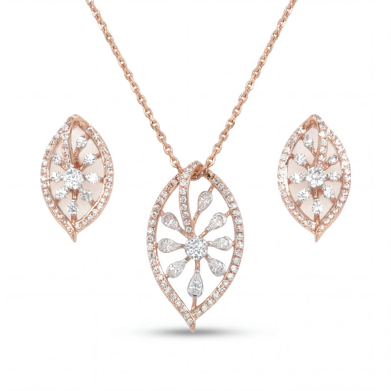 Elegant 18KT rose gold pendant set featuring leaf-shaped diamond pendant with matching floral earrings on a white background.