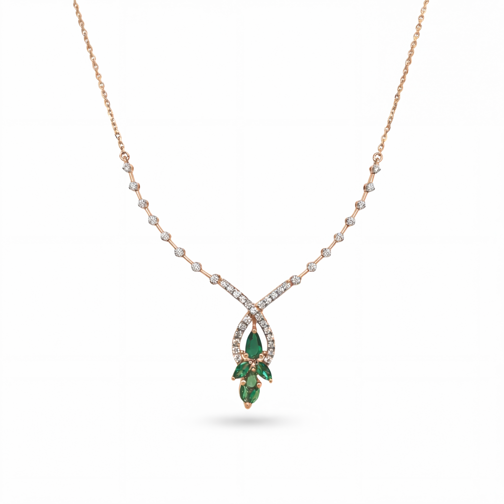 Beautiful 18KT rose gold necklace showcasing a sparkling diamond chain with teardrop pendant and green gemstone cluster on a white background.