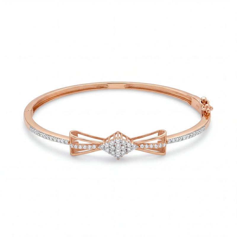 Beautiful 18KT rose gold bangle showcasing slim diamond-set bands with an intricate bow centerpiece on a white background.