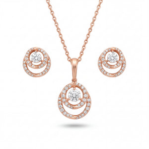 Beautiful 18KT rose gold jewelry set showcasing round layered pendants with sparkling center diamonds and coordinated earrings on a white background.