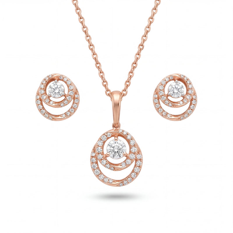 Beautiful 18KT rose gold jewelry set showcasing round layered pendants with sparkling center diamonds and coordinated earrings on a white background.