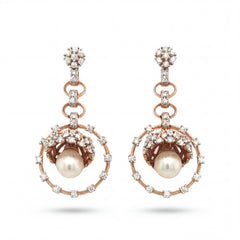 Elegant 18KT rose gold drop earrings featuring pearl centers with diamond halo circles and floral diamond tops on a white background.