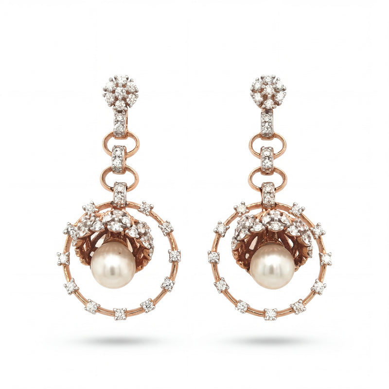 Elegant 18KT rose gold drop earrings featuring pearl centers with diamond halo circles and floral diamond tops on a white background.
