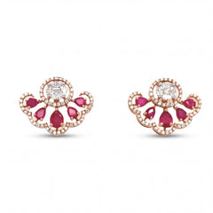 Elegant 18KT rose gold stud earrings featuring ruby pear-shaped stones with oval center diamonds and halo accents on a white background.