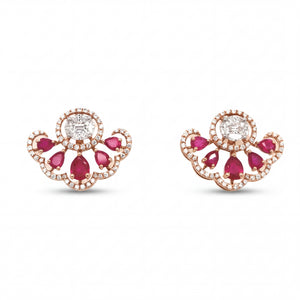 Elegant 18KT rose gold stud earrings featuring ruby pear-shaped stones with oval center diamonds and halo accents on a white background.