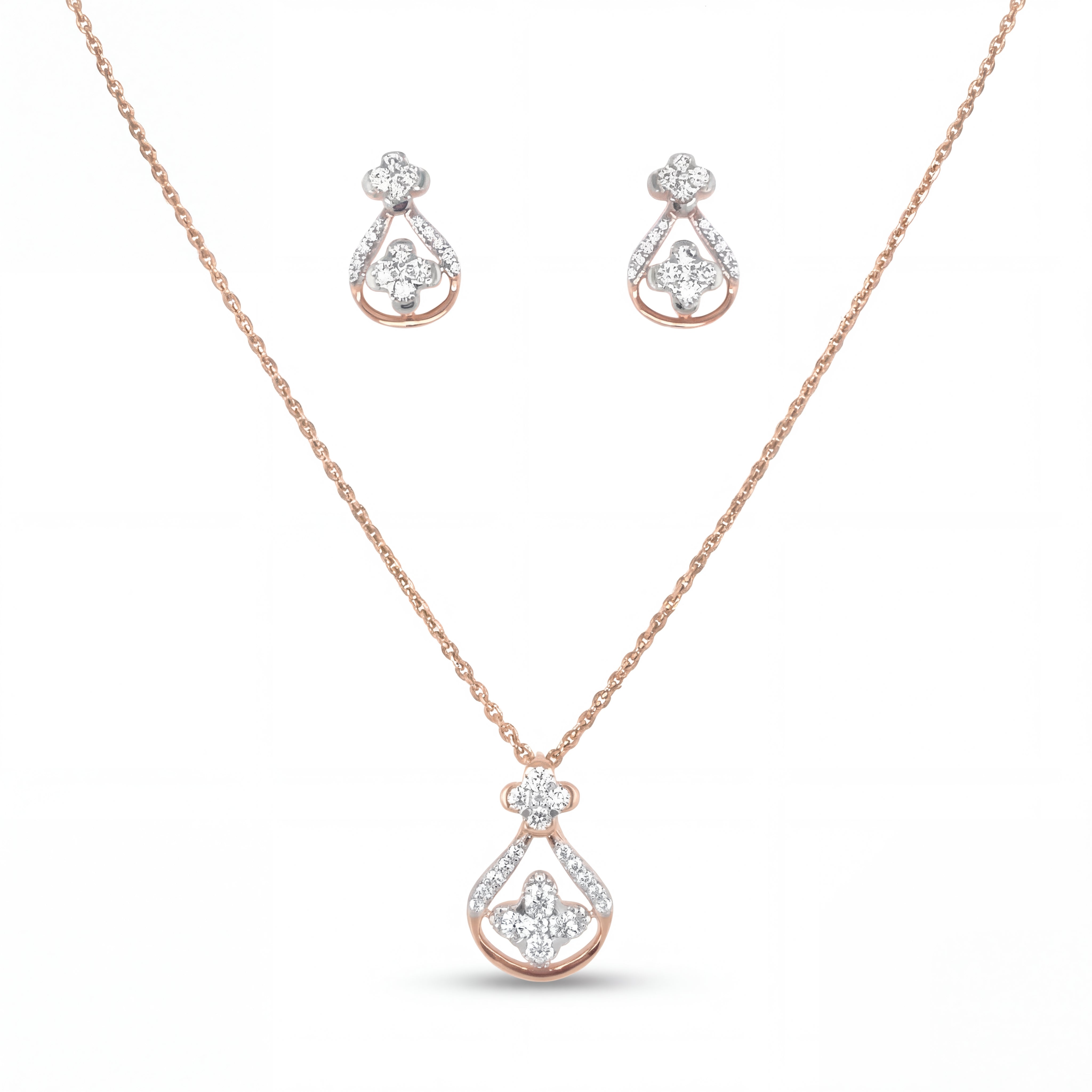 Beautiful 18KT rose gold necklace set showcasing teardrop-inspired diamond pendant and matching earrings with floral accents on a white background.