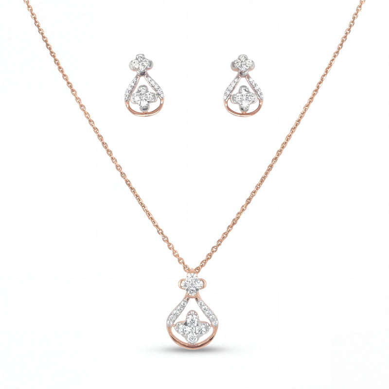 Beautiful 18KT rose gold necklace set showcasing teardrop-inspired diamond pendant and matching earrings with floral accents on a white background.
