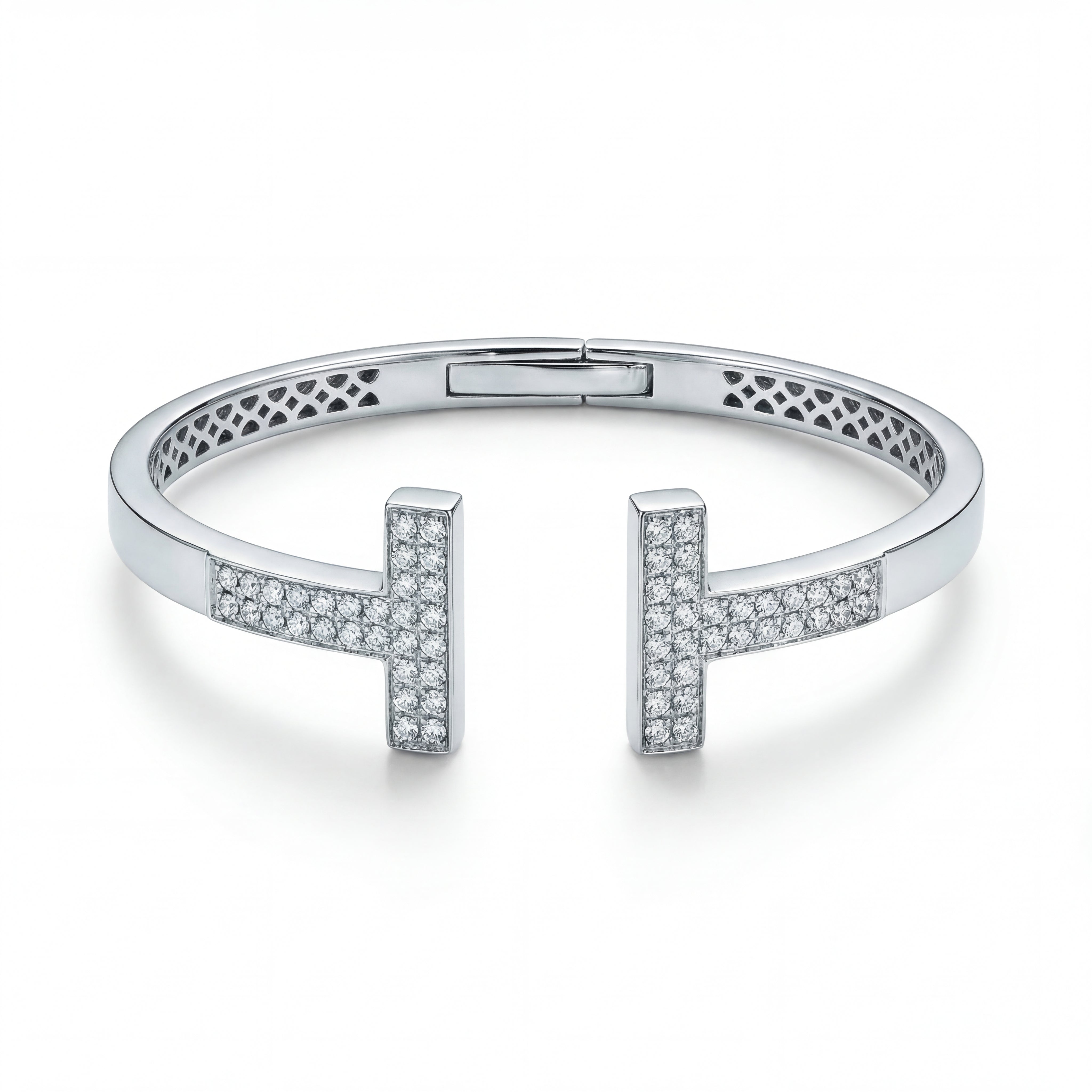 Elegant 18KT white gold open bangle featuring twin T-shaped diamond-studded ends on a white background.