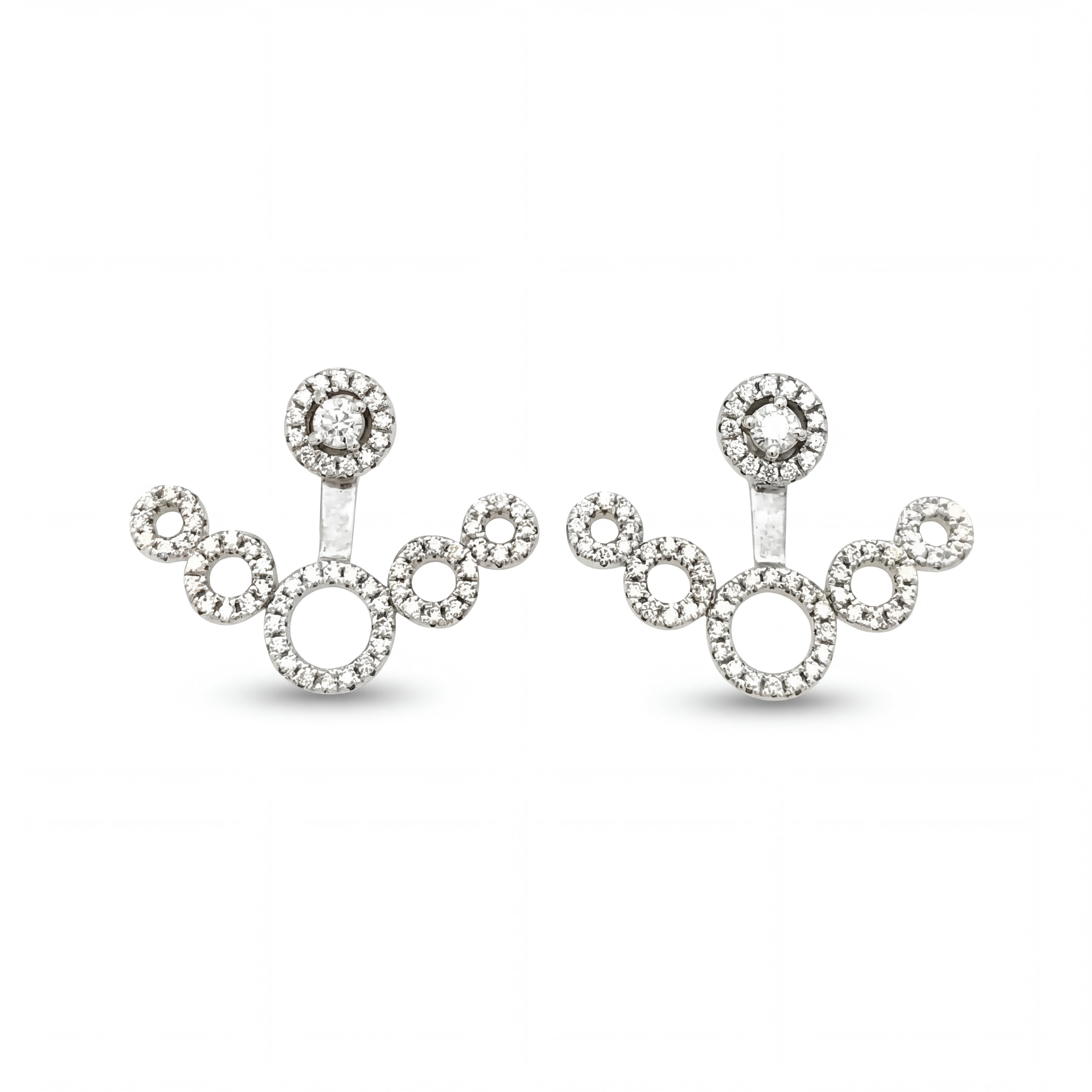 Luxurious 18KT white gold earrings featuring artistic multi-circle design with brilliant diamond accents and contemporary elegance on a white background.