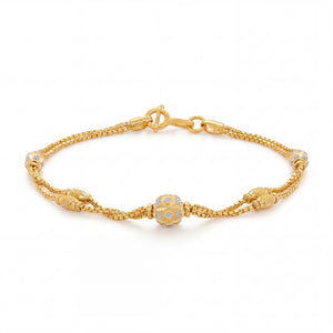 Stylish 18K gold bracelet with intricate braided chain, sparkling white stone centerpiece and ornamental gold detailing crafted by Pachchigar Jewellers Ashokbhai