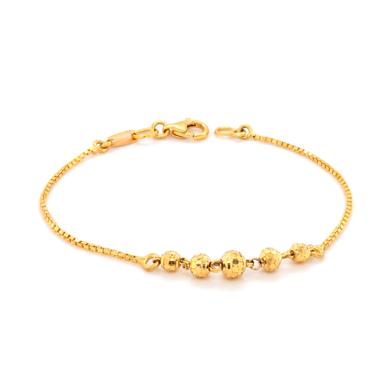 Stylish 18K gold chain bracelet with decorative polished and textured gold beads in a sleek modern design by Pachchigar Jewellers Ashokbhai