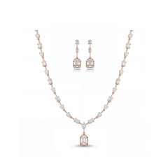 Luxurious 18K rose gold necklace set featuring geometric baguette and pear-cut diamonds with statement pendant and matching Art Deco drop earrings.