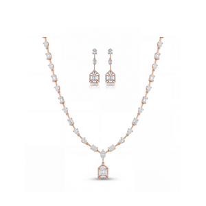 Luxurious 18K rose gold necklace set featuring geometric baguette and pear-cut diamonds with statement pendant and matching Art Deco drop earrings.