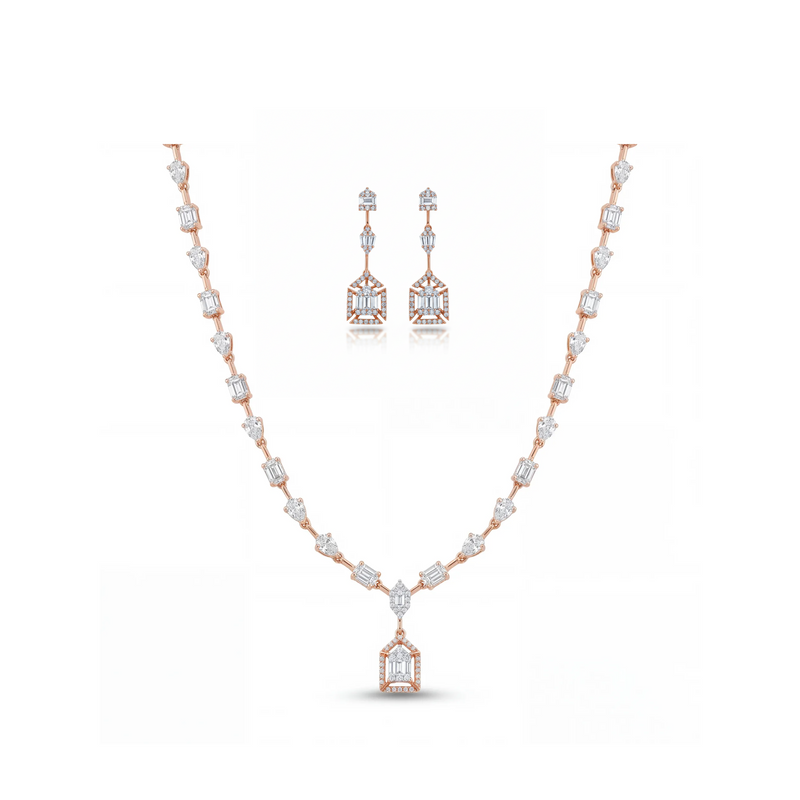 Luxurious 18K rose gold necklace set featuring geometric baguette and pear-cut diamonds with statement pendant and matching Art Deco drop earrings.