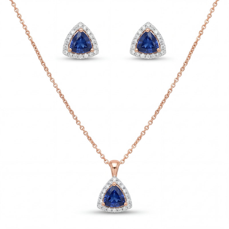 Elegant 18K rose gold blue sapphire diamond pendant earrings set featuring trillion cut blue sapphires with diamond halo necklace and matching stud earrings by Pachchigar Jewellers Ashokbhai