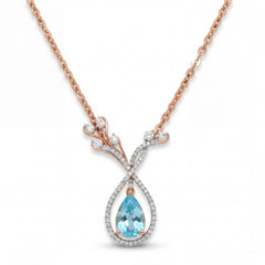 Elegant 18K rose gold blue topaz diamond pendant necklace featuring pear cut blue topaz with pavé diamond halo and floral branch motif by Pachchigar Jewellers Ashokbhai