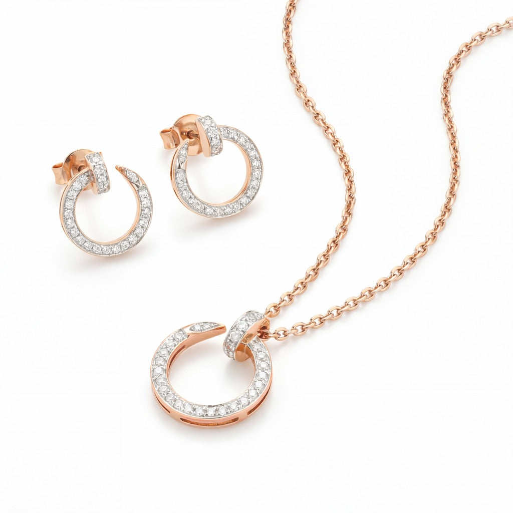 Elegant 18K rose gold diamond circle pendant earrings set featuring pavé diamond open circle pendant with matching hoop earrings by Pachchigar Jewellers Ashokbhai