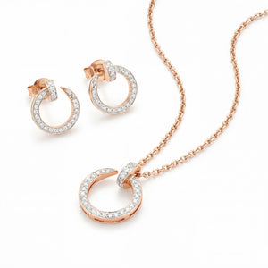 Elegant 18K rose gold diamond circle pendant earrings set featuring pavé diamond open circle pendant with matching hoop earrings by Pachchigar Jewellers Ashokbhai