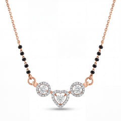 Elegant 18K rose gold diamond heart mangalsutra pendant necklace featuring heart shaped center diamond motif with round diamond halo accents and black bead chain by Pachchigar Jewellers Ashokbhai