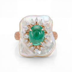 Luxurious 18K rose gold emerald mother of pearl statement ring featuring natural mother of pearl face with oval emerald center and marquise diamond sunburst halo by Pachchigar Jewellers Ashokbhai