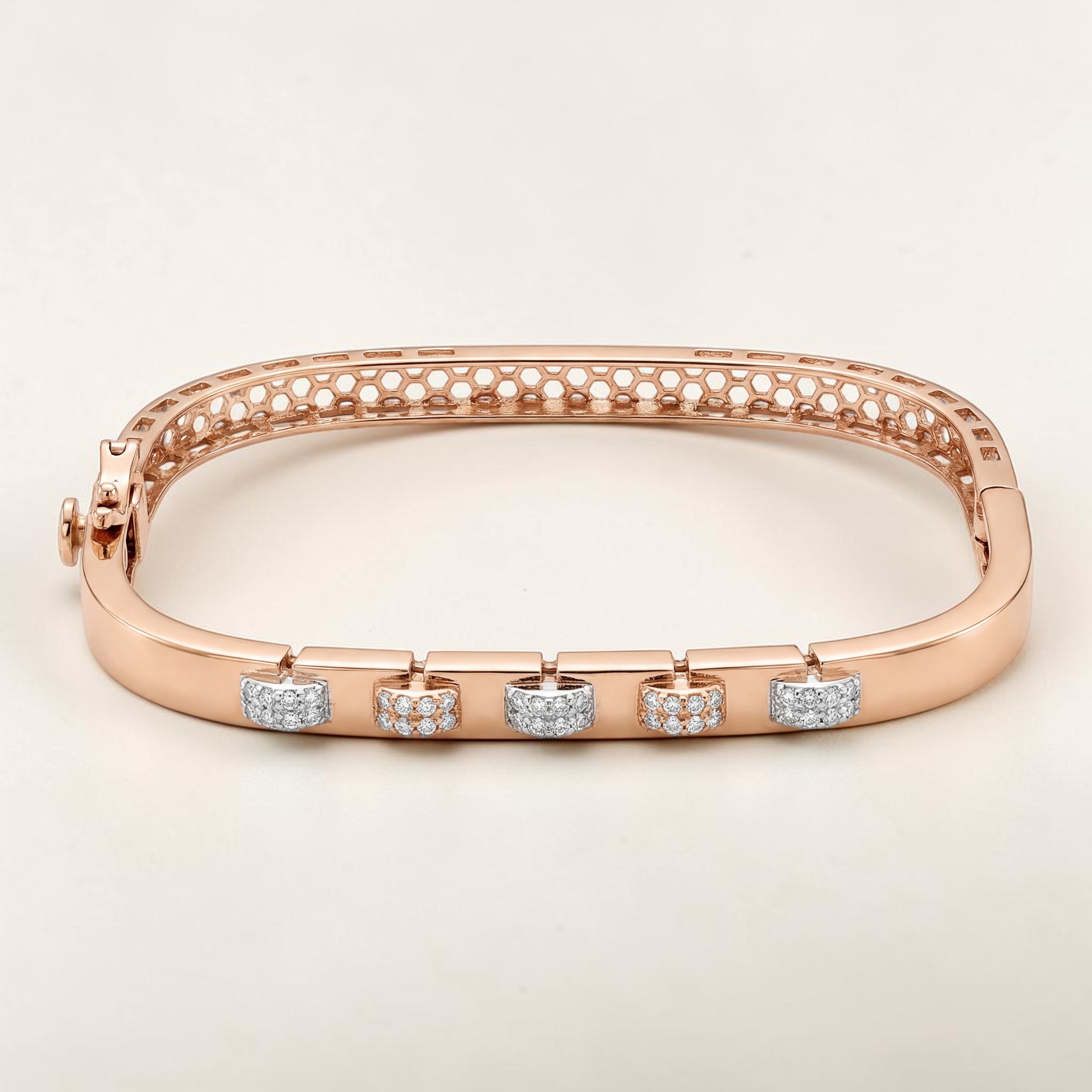 Elegant 18K rose gold designer kada featuring five floating diamond charm motifs with alternating pavé-set and textured finishes. Contemporary luxury bracelet by Pachchigar Jewellers.