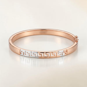 Minimalist 18K rose gold designer kada featuring a dual-tone Greek key pattern in white gold, polished finish, and secure clasp. Elegant luxury bracelet by Pachchigar Jewellers.