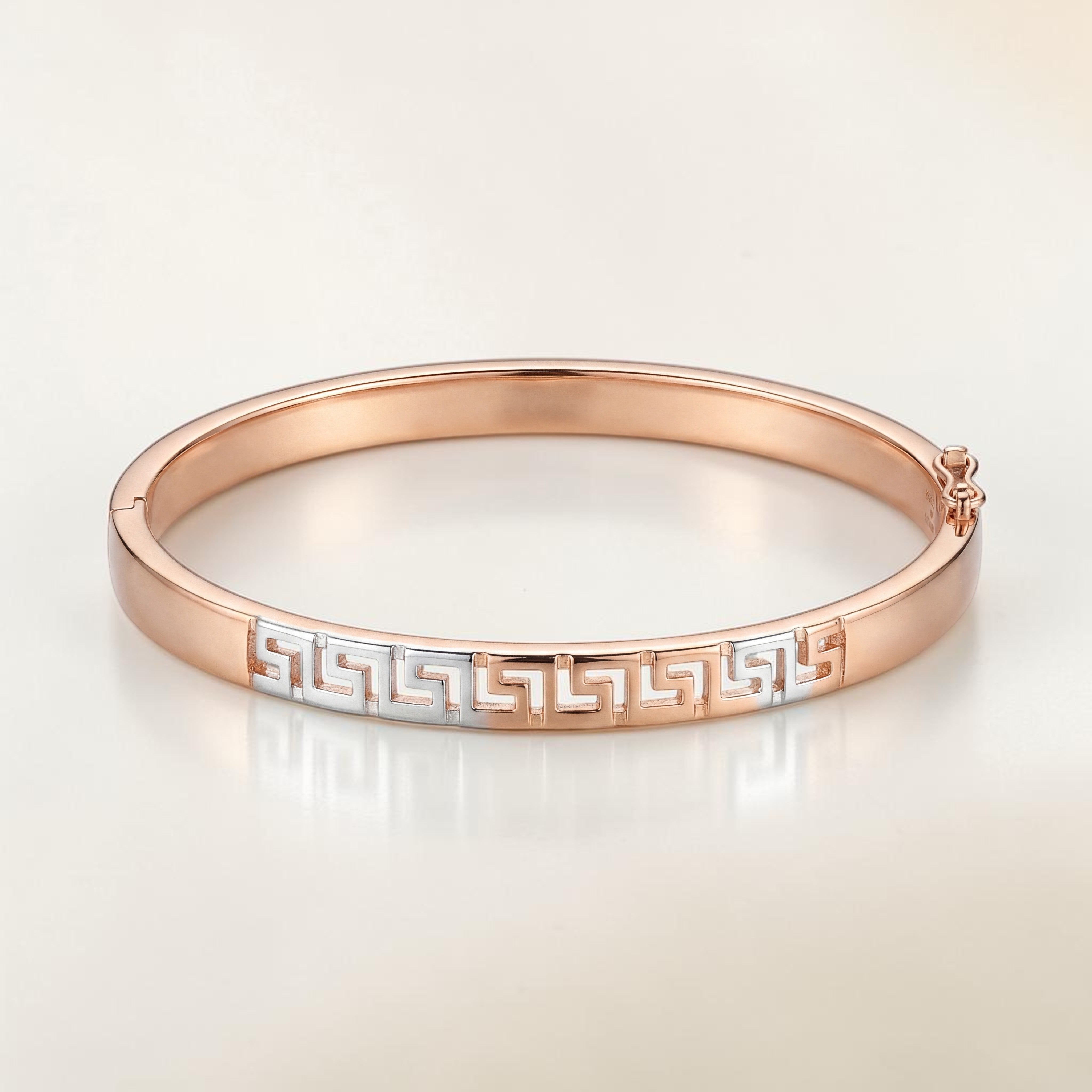 Minimalist 18K rose gold designer kada featuring a dual-tone Greek key pattern in white gold, polished finish, and secure clasp. Elegant luxury bracelet by Pachchigar Jewellers.