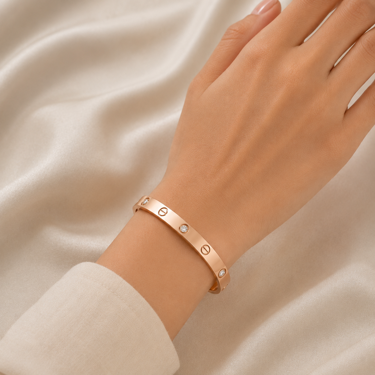 Elegant 18K rose gold designer bangle featuring bezel-set round brilliant diamonds, signature screw-inspired motifs, a sleek polished finish, and a timeless contemporary design. Luxury diamond bracelet by Pachchigar Jewellers.