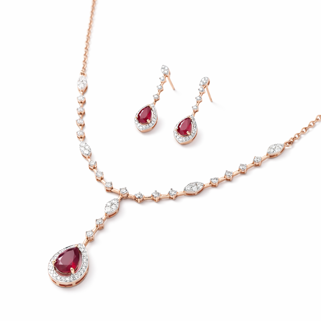 Elegant 18K rose gold necklace set featuring pear-shaped ruby drop pendant with diamond halo, marquise accents, and matching dangling ruby diamond earrings.