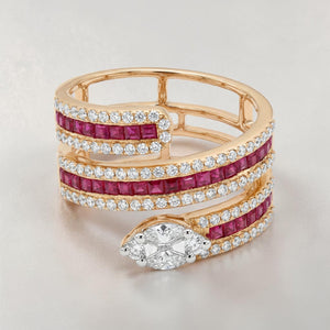 Elegant 18K rose gold spiral wrap ring featuring vivid ruby gemstone rows, pavé diamonds, and a pear-cut white center diamond in a modern luxury design.