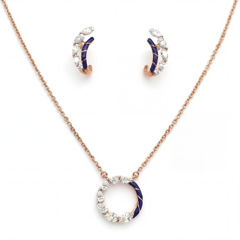 Elegant 18K rose gold jewelry set featuring a circular pendant necklace with blue enamel and marquise diamond accents, paired with matching hoop earrings.