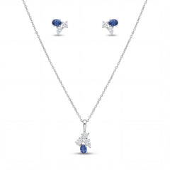 Elegant 18K white gold blue sapphire diamond pendant earrings set featuring oval blue sapphires with floral diamond accents necklace and matching stud earrings by Pachchigar Jewellers Ashokbhai
