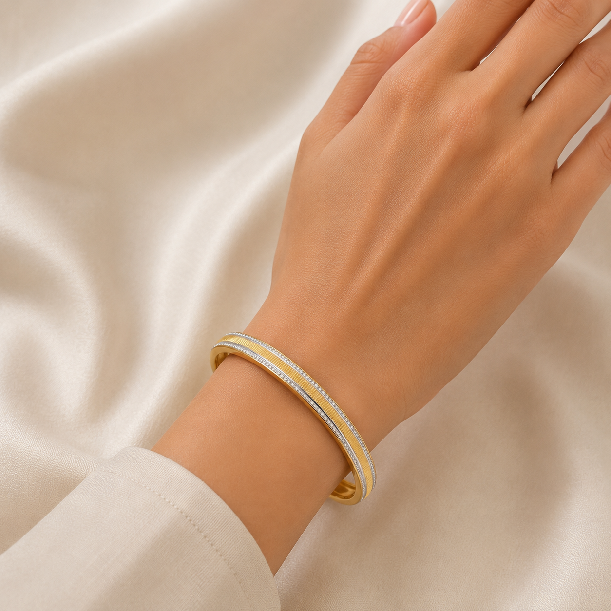 Elegant 18K yellow gold designer bangle featuring dual parallel rows of pavé-set brilliant diamonds, a sleek polished profile, and a refined contemporary silhouette. Luxury diamond bracelet by Pachchigar Jewellers.