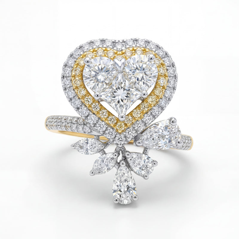 Elegant 18K yellow gold diamond heart bow statement ring featuring heart shaped center cluster with pavé halo and pear diamond accents by Pachchigar Jewellers Ashokbhai