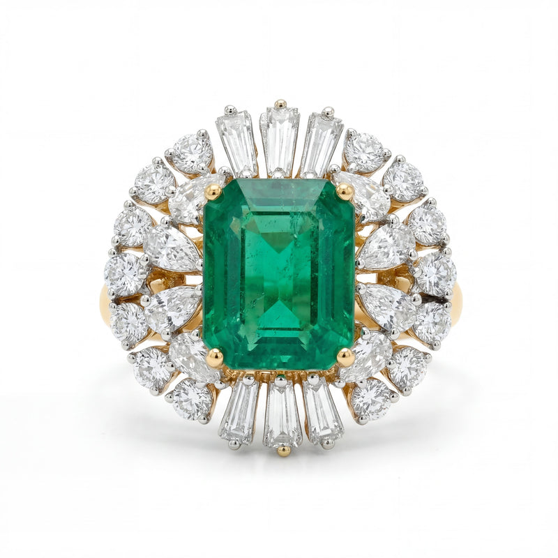 Elegant 18K yellow gold emerald diamond halo statement ring featuring emerald cut center emerald with pear and baguette cut diamond surround by Pachchigar Jewellers Ashokbhai