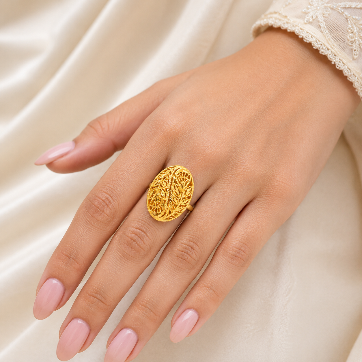 Elegant 18K yellow gold statement ring featuring an oval openwork filigree design with intricate handcrafted lattice detailing and a timeless heritage finish. Luxury designer gold ring by Pachchigar Jewellers.