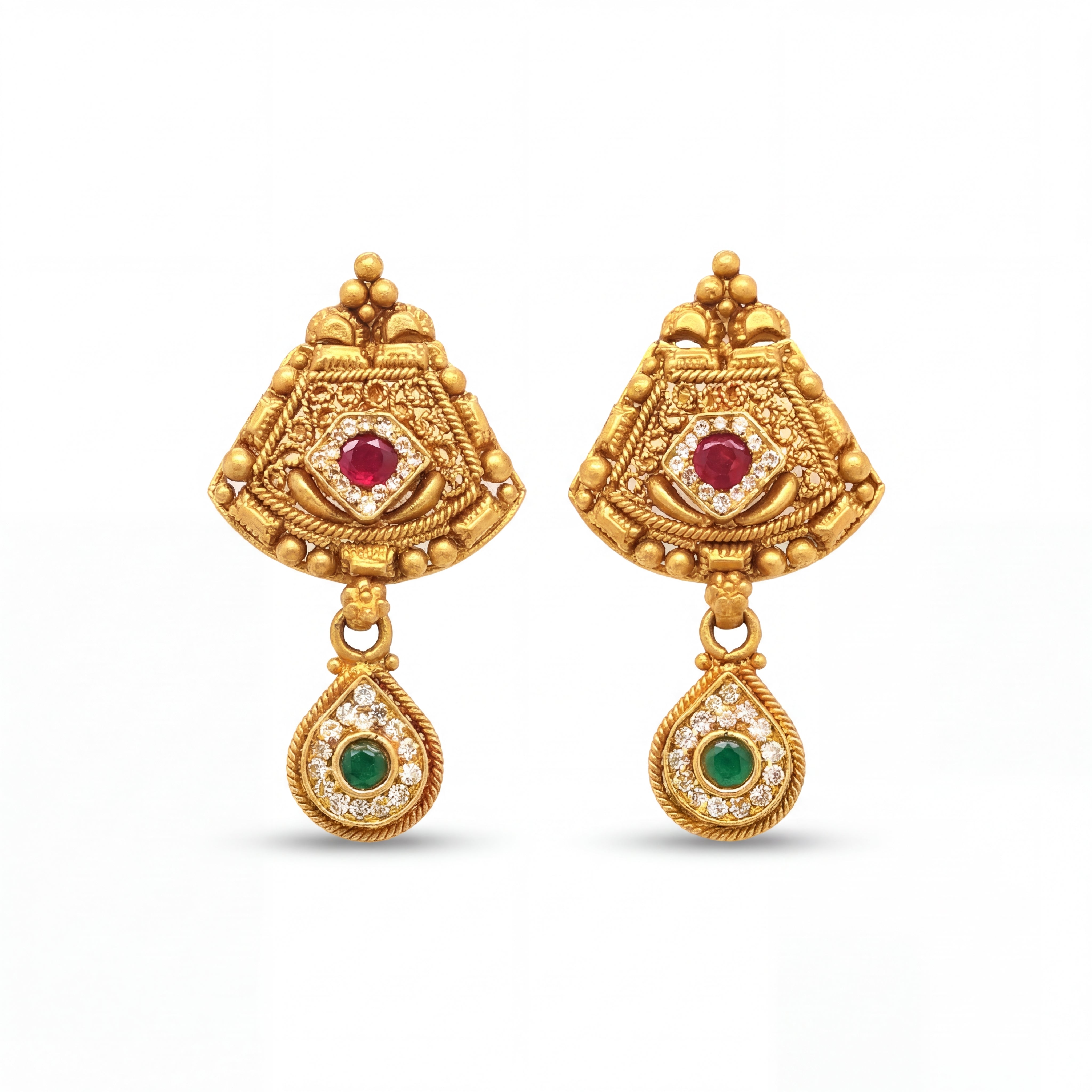 Elegant 22KT yellow gold antique earrings featuring ruby center stones, emerald drop motifs, and intricate traditional detailing on a white background.