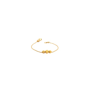 Elegant 22KT yellow gold bracelet featuring a delicate box chain with three textured gold bead accents on a white background.