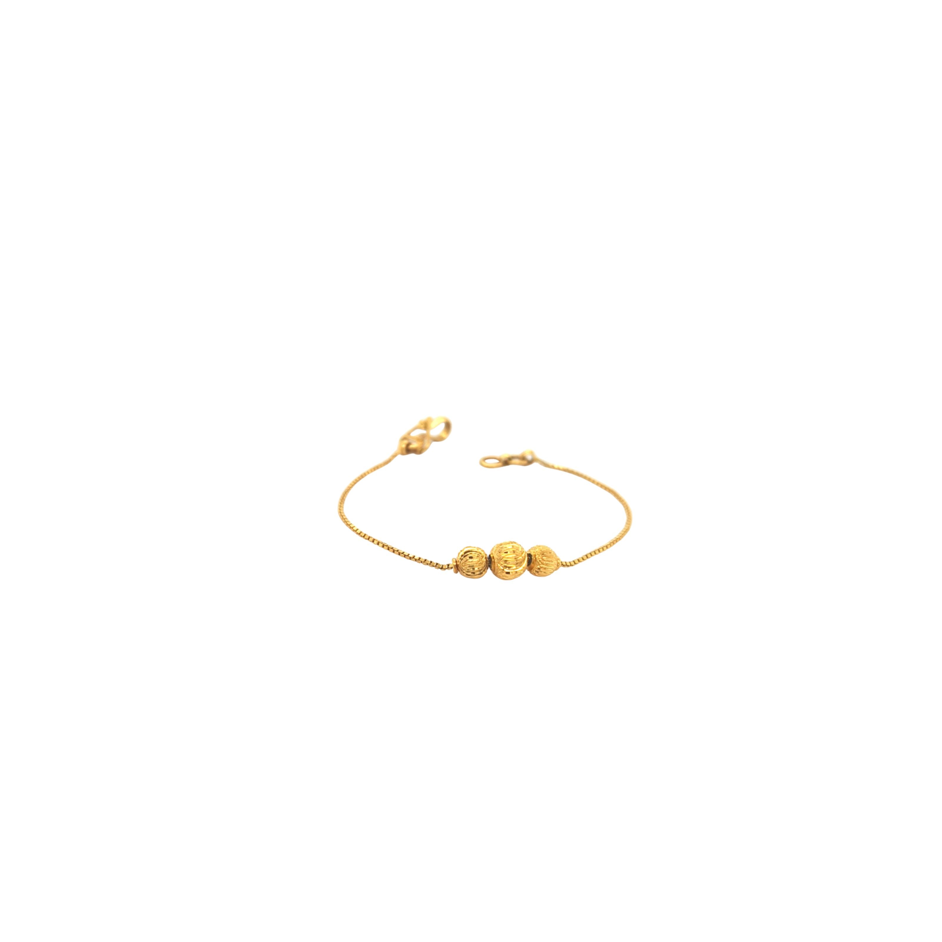 Elegant 22KT yellow gold bracelet featuring a delicate box chain with three textured gold bead accents on a white background.