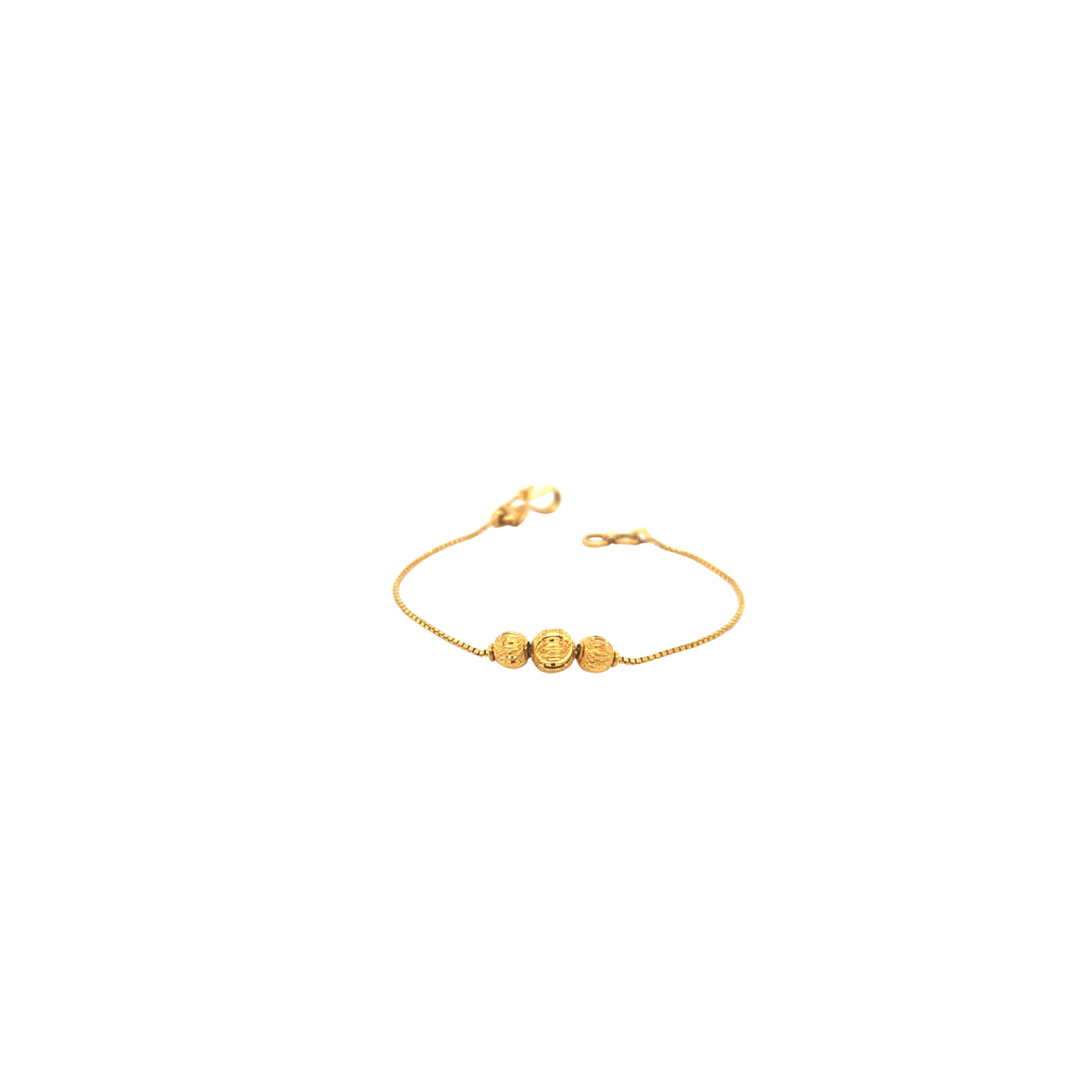 Elegant 22KT yellow gold bracelet featuring a delicate box chain with three textured gold bead accents on a white background.
