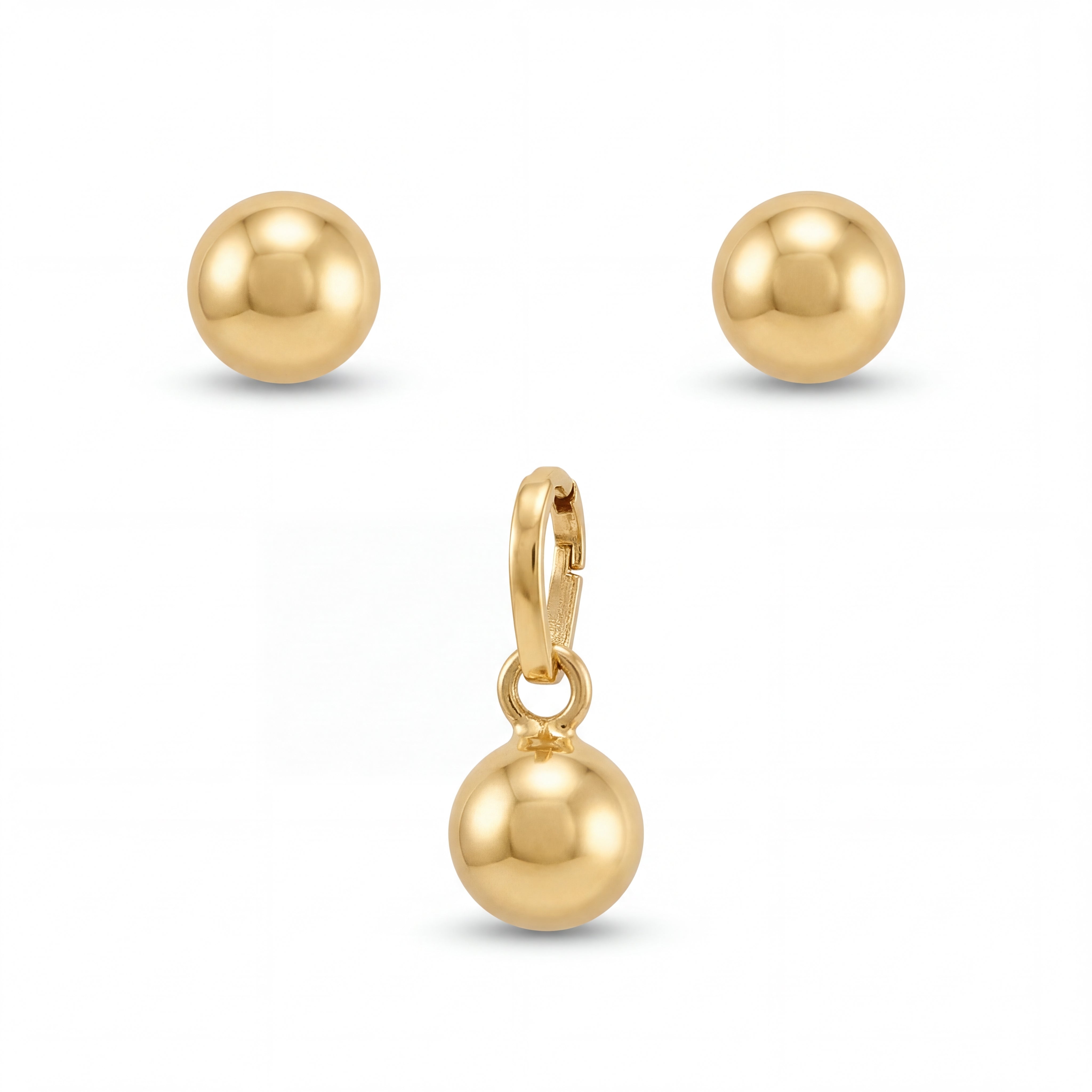 Minimalist 22KT yellow gold pendant set featuring polished gold ball pendant with matching round stud earrings on a white background.