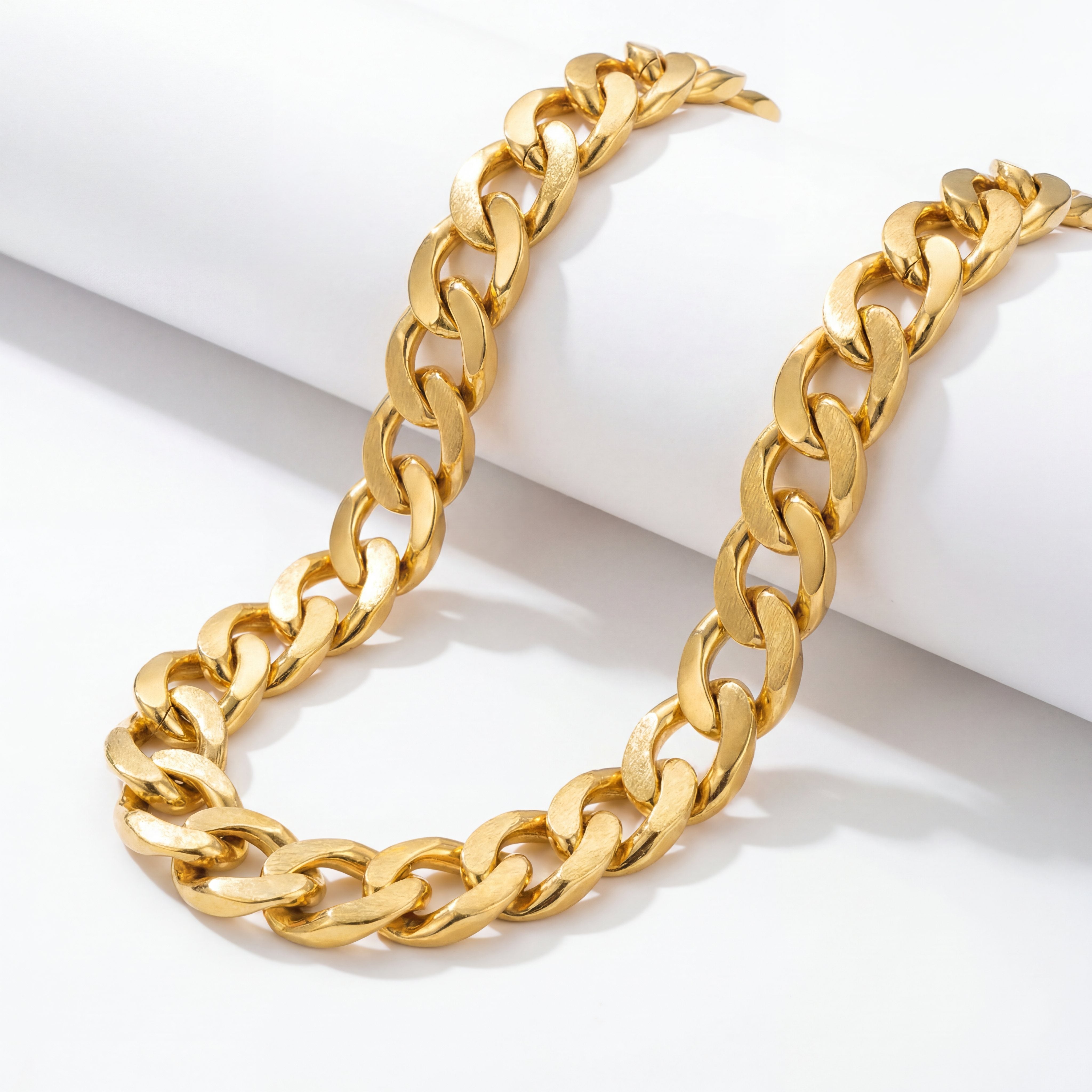 22KT BIS Hallmarked gold Cuban link chain featuring broad matte-finish interlocking links with polished edges. A bold, premium yellow gold chain ideal for men, perfect for daily wear, festive occasions, and gifting from Pachchigar Jewellers.