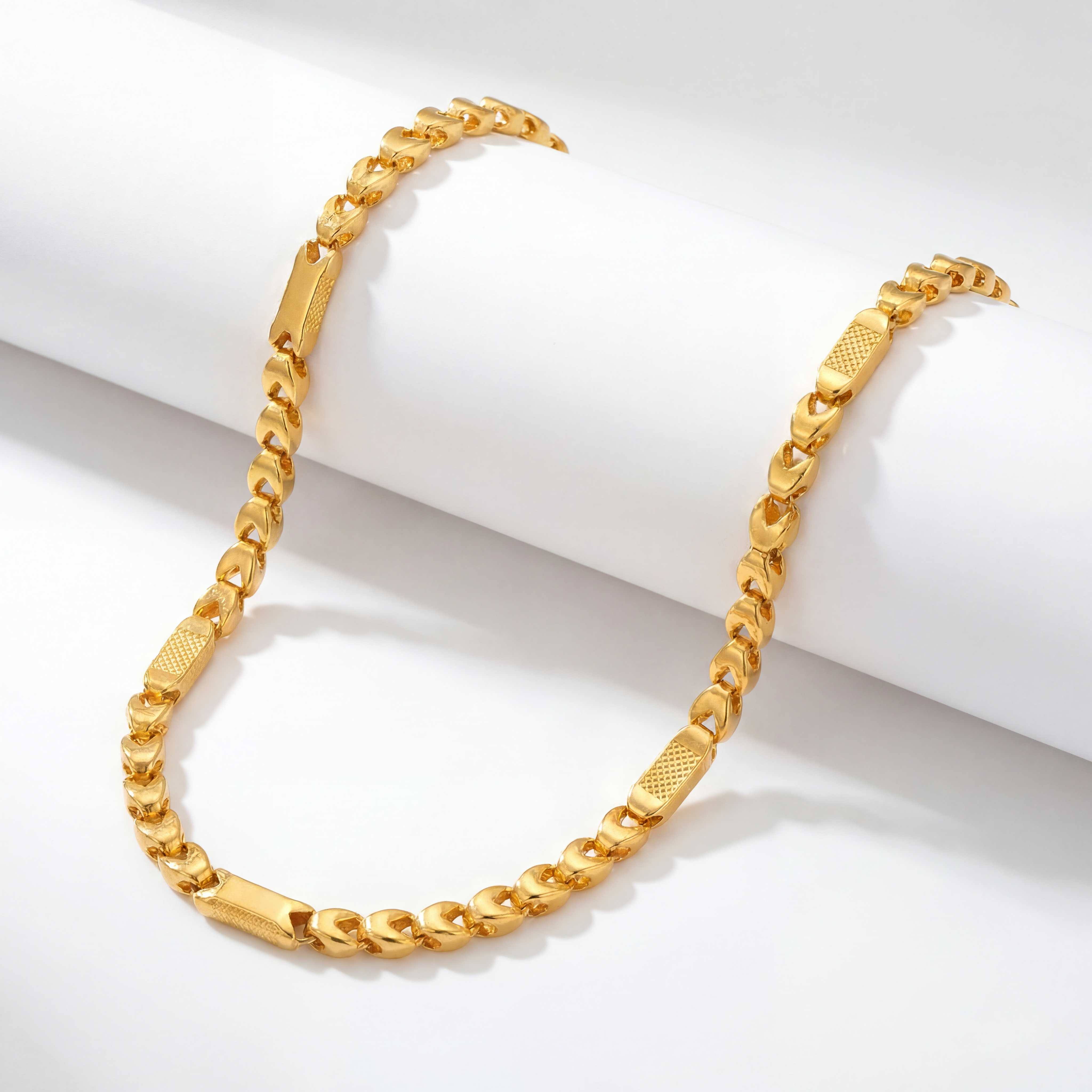 22KT BIS Hallmarked gold designer bar link chain featuring polished curb links with textured rectangular bar accents in a modern Figaro-inspired design. A stylish yellow gold chain for men, ideal for everyday wear, festive occasions, and gifting from Pachchigar Jewellers.