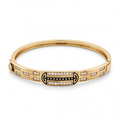 Elegant 22KT gold kada bracelet featuring black enamel centerpiece with sparkling diamond accents on a white background.