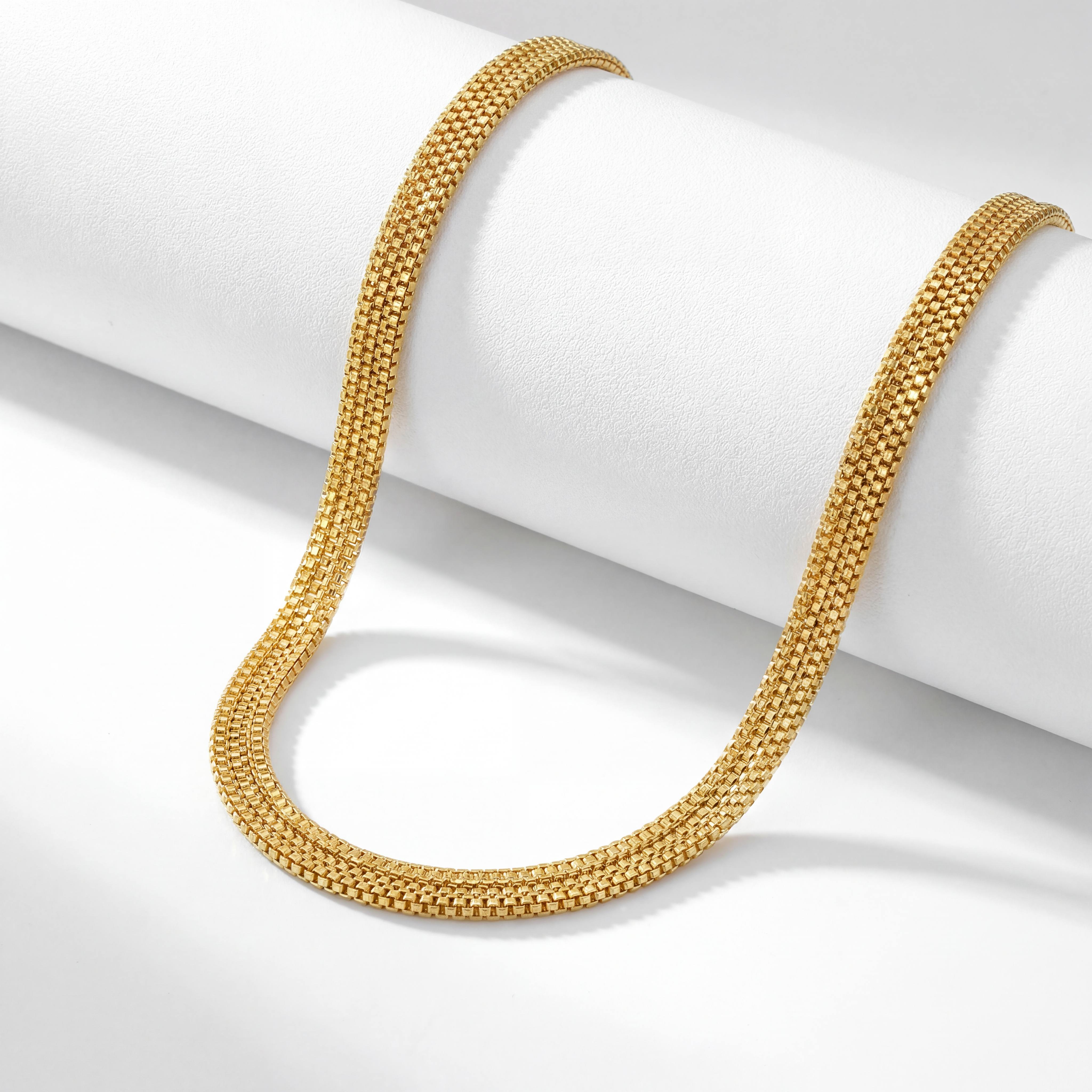 22KT BIS Hallmarked gold flat mesh chain featuring a finely woven link pattern with a sleek, flexible design and brilliant yellow gold finish. A timeless, lightweight gold chain ideal for everyday wear, layering, festive occasions, and gifting from Pachchigar Jewellers.